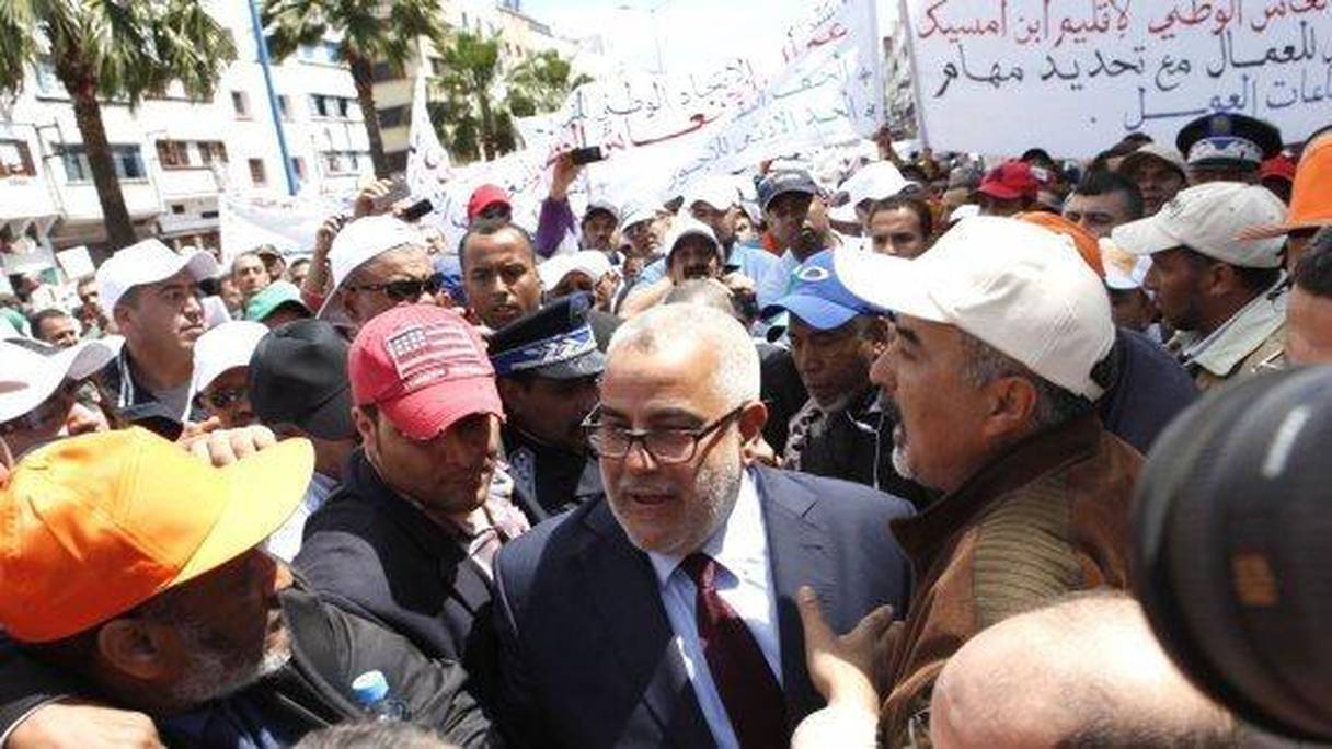 Abdelilah Benkirane avec des militants de l'UNTM, syndicat proche du PJD, lors de la célébration du 1e Mai 2014.
